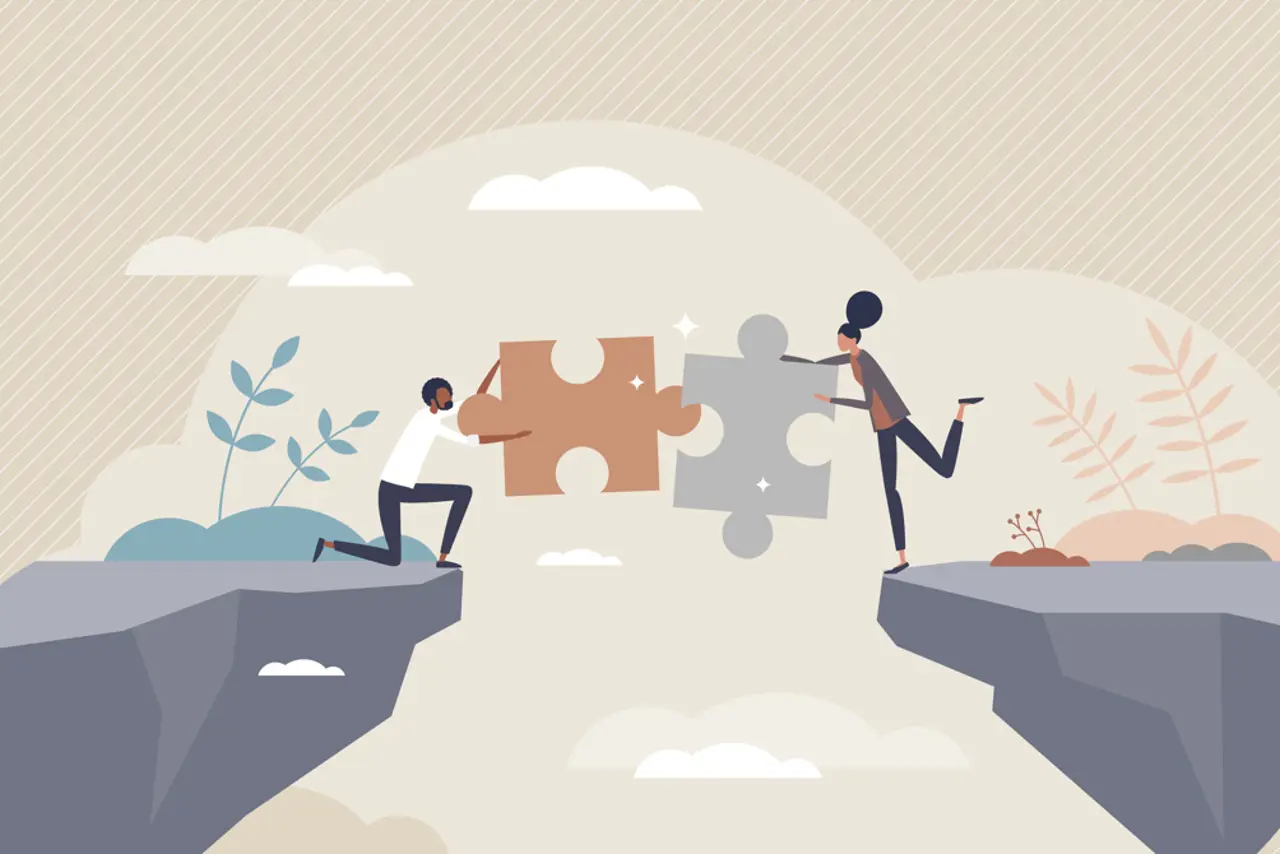 Illustrasjon med to personer som setter sammen puslespillbiter